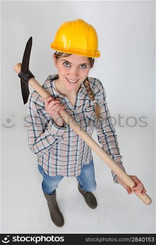 Tradeswoman holding a pickaxe