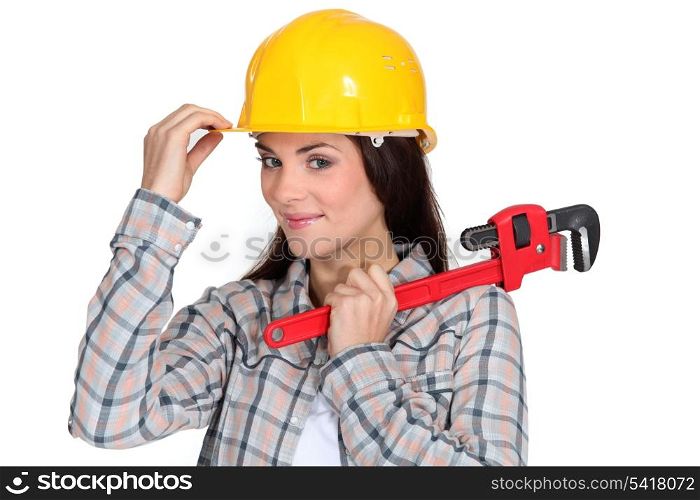 Tradeswoman holding a pipe wrench