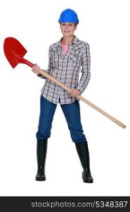 Tradeswoman holding a spade