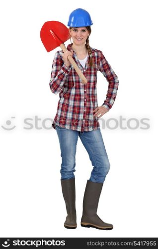 Tradeswoman holding a spade