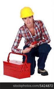 Tradeswoman holding a wrench