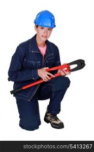 Tradeswoman holding large clippers