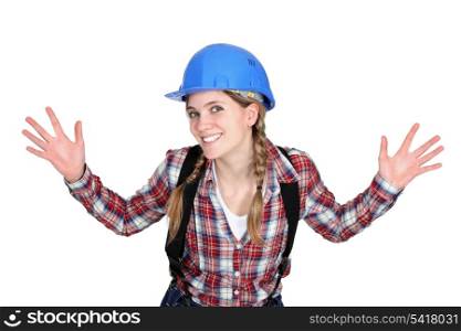 Tradeswoman holding up her hands