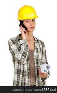 Tradeswoman using mobile phone