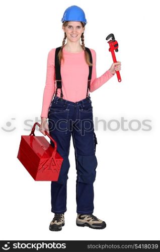 Tradeswoman with a pipe wrench