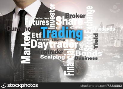 Trading wordcloud touchscreen is shown by businessman.. Trading wordcloud touchscreen is shown by businessman