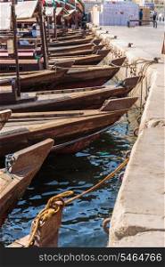 Traditional Abra boat at the pier in Dubai. Traditional Abra boats in Dubai