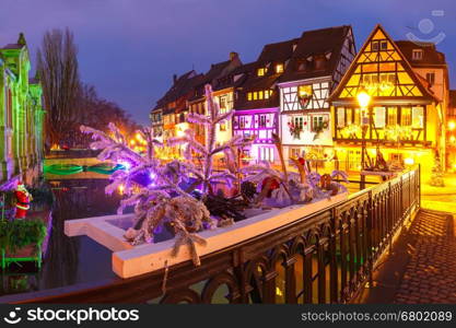 Traditional Alsatian half-timbered houses in Petite Venise, old town of Colmar, decorated and illuminated at christmas time, Alsace, France