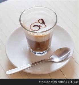 Traditional and artistic Italian coffee with milk and decoration