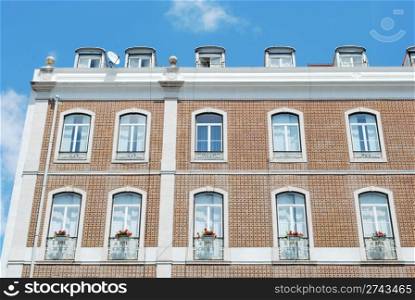 traditional and classic residential building (flowers in balcony)