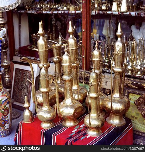 Traditional Arab coffee pots on sale in Souq Waqif in Qatar, Arabia. Medium format film photo.