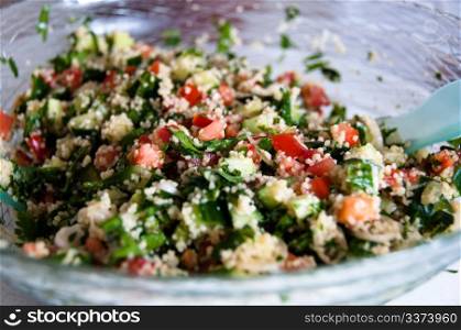 Traditional Arabian dish: Tabouleh salad with couscous, mint, tomatoes and parsley.
