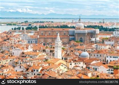 Traditional architecture in Venice.. Aerial view from the bell tower on the red tiled roofs of Venice. Italy.