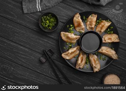 traditional asian dumplings plate with chopsticks herbs. Resolution and high quality beautiful photo. traditional asian dumplings plate with chopsticks herbs. High quality and resolution beautiful photo concept