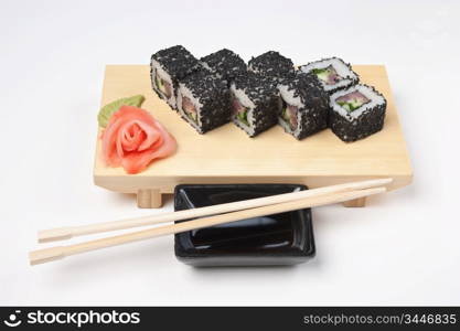 Traditional Asian food sushi on wooden plate