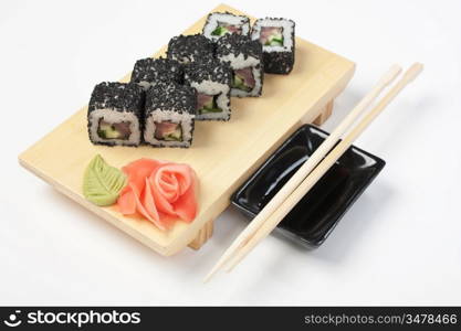 Traditional Asian food sushi on wooden plate