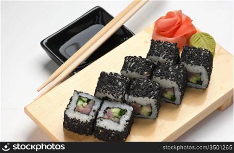 Traditional Asian food sushi on wooden plate