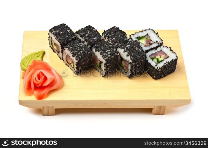 Traditional Asian food sushi on wooden plate isolated on white background