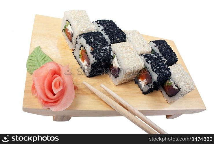 Traditional Asian food sushi on wooden plate isolated on white background