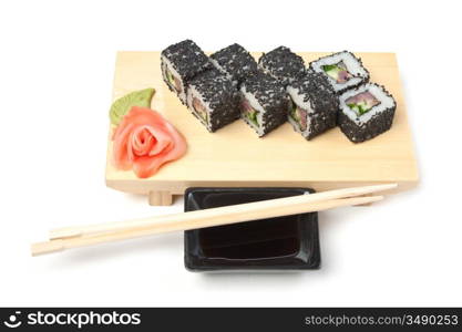 Traditional Asian food sushi on wooden plate isolated on white background