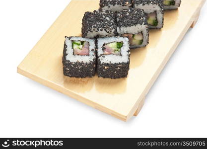 Traditional Asian food sushi on wooden plate isolated on white background