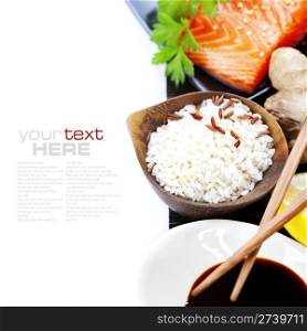 traditional asian ingredients (Fresh salmon steak filet, uncooked rice, ginger, lemon, soy sause and chopsticks) over white with sample text