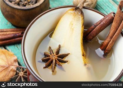 Traditional autumn alcoholic drink.Warm pear mulled wine.Pear wine with spices.. Hot pear wine.