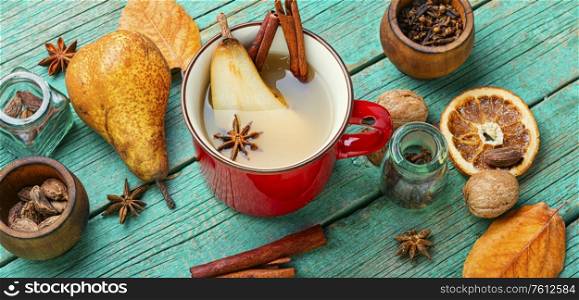 Traditional autumn alcoholic drink.Warm pear mulled wine.Pear wine with spices.. Hot pear wine.