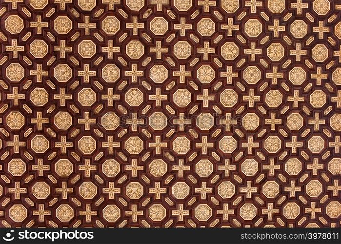 Traditional background design with cross and octagon shapes on Plaza de Espana corridor ceiling, Spain.