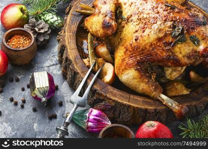 Traditional baked chicken stuffed with apples for Christmas.Christmas turkey. Traditional christmas chicken