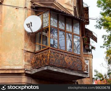 Traditional balcony on the facade of an old house. Lviv. Ukraine.. Lviv. Traditional balcony in an old house.