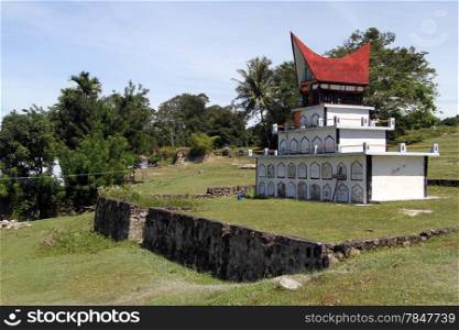 Traditional batak grave on the green field on the Samosir island, Indonesia