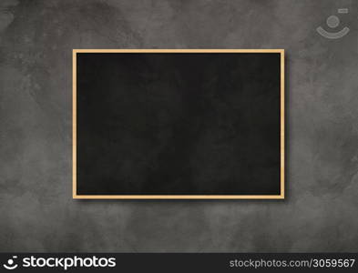 Traditional black board isolated on a dark concrete background. Blank horizontal mockup template. Traditional black board isolated on a dark concrete background