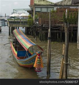 Traditional boat moored at dock, Bangkok, Thailand