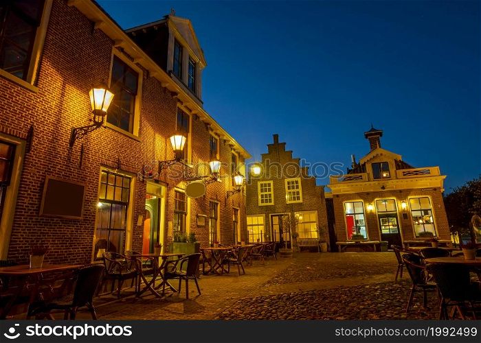 Traditional buildings in the historical city Sloten in Friesland the Netherlands at sunset