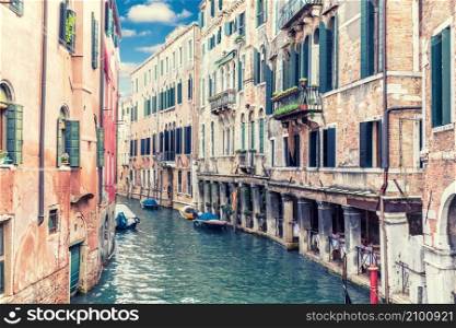 Traditional canal of Venice, beautiful retro view, Italy.