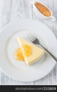 Traditional cheesecake on the wooden table flat lay