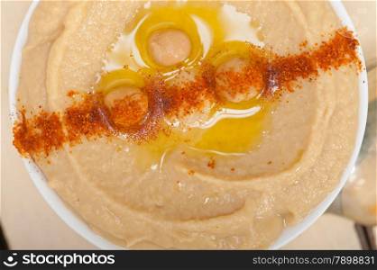 traditional chickpeas Hummus with mint olive oil and paprika on top