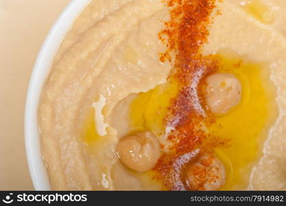 traditional chickpeas Hummus with mint olive oil and paprika on top