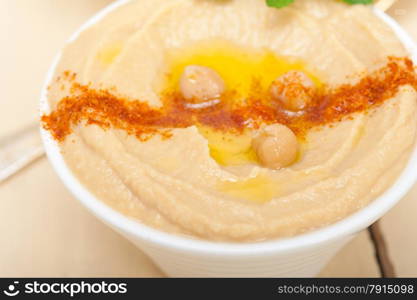 traditional chickpeas Hummus with mint olive oil and paprika on top