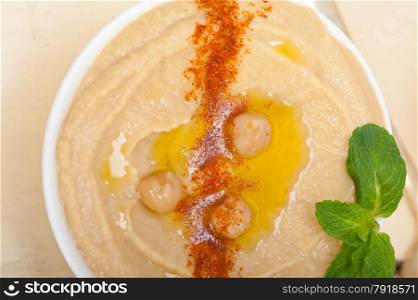 traditional chickpeas Hummus with mint olive oil and paprika on top