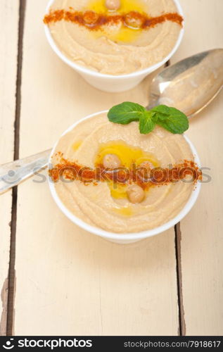 traditional chickpeas Hummus with mint olive oil and paprika on top