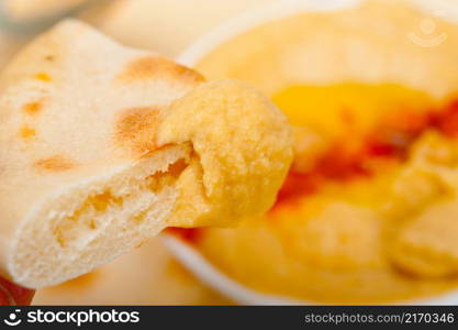 traditional chickpeas Hummus with pita bread and paprika on top