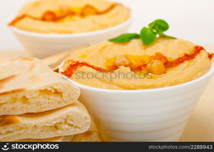 traditional chickpeas Hummus with pita bread and paprika on top