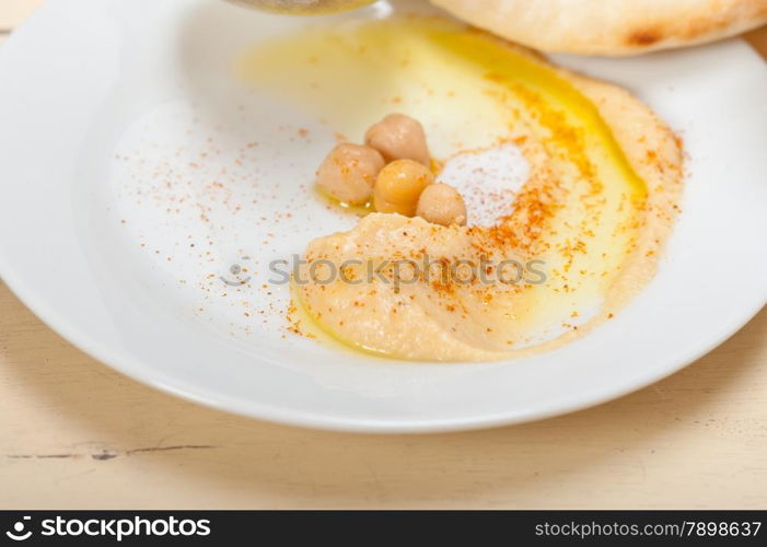 traditional chickpeas Hummus with pita bread and paprika on top