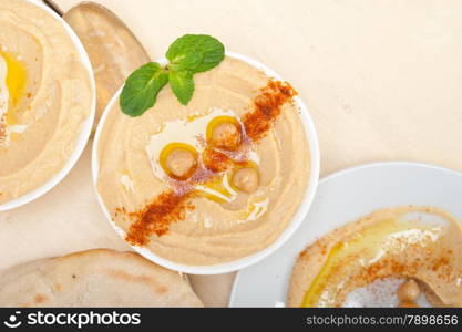 traditional chickpeas Hummus with pita bread and paprika on top