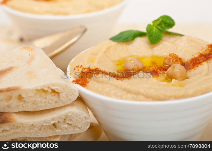 traditional chickpeas Hummus with pita bread and paprika on top