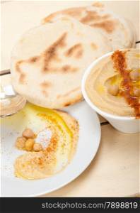 traditional chickpeas Hummus with pita bread and paprika on top