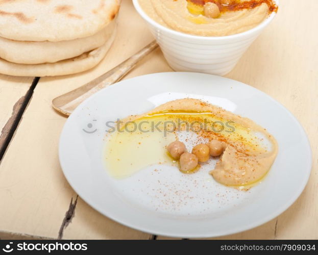 traditional chickpeas Hummus with pita bread and paprika on top