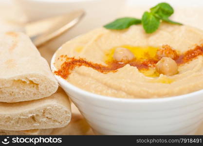 traditional chickpeas Hummus with pita bread and paprika on top